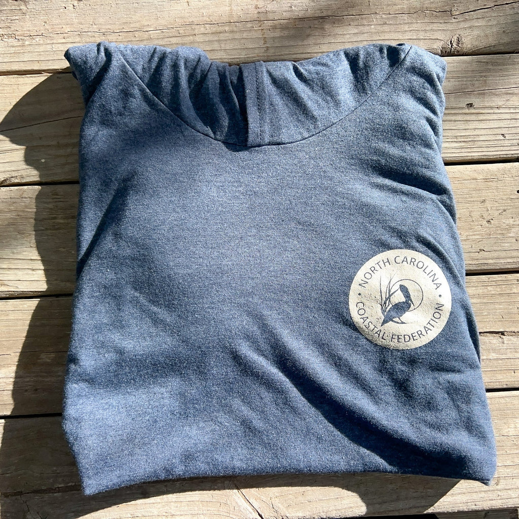 Blue light-weight long-sleeve hoodie with a logo on a wooden surface
